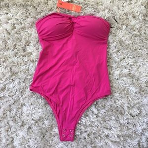 Pink body suit new with tags . Size small